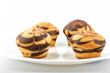Delicious homemade muffins on a white plate.