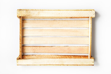Naklejka na ściany i meble Empty Wooden box for vegetables and fruits on a white background.