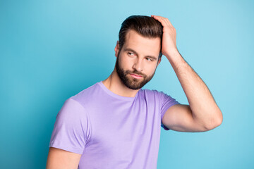 Photo of young attractive man dream dreamy enjoy new hair gel hand touch head look empty space isolated over blue color background