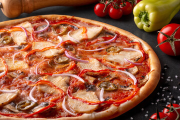 pizza on black background with ingredients