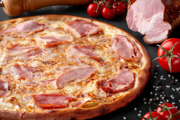 pizza on black background with ingredients