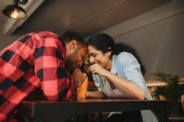 Naklejka premium Loving couple having juice from same glass