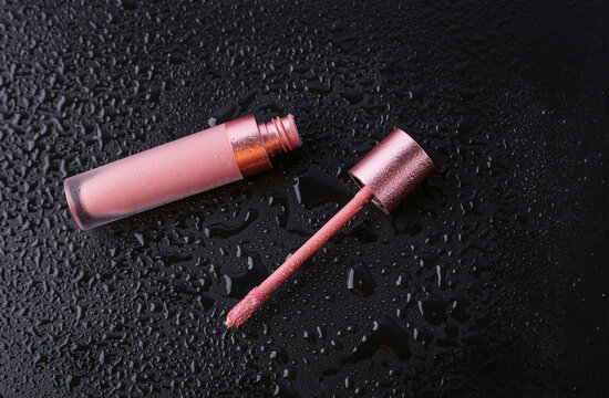 Pink Lip Gloss On A Wet Table