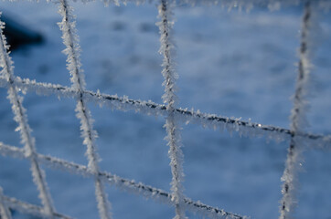 frosty metal mesh closeup, frost