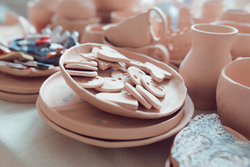 Unglazed pottery in an artist's workshop waiting to be processed