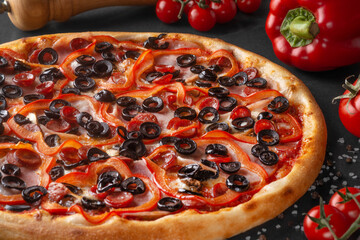 pizza on black background with ingredients