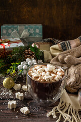 Christmas presents and hot cocoa with marshmallows on the wooden table. Copy space.