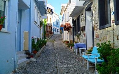 View of narrow and colorful street of Bozcaada located in Canakkale, Turkey.