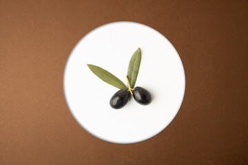 black olives, on brown background