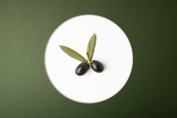 black olives, on green background