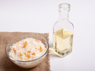 Sauerkraut. Fermented vegetables. Sunflower oil. On a white background. Russian kitchen.