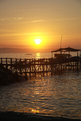Fototapeta na wymiar Fishing boat dock at sunset. Beautiful scenery