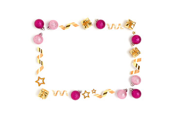 Frame made of Christmas toys and confetti on a white background. New Years concept with copy space.