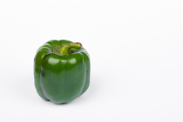 Green fresh capsicum vegetable on white background