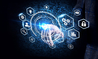 Internet of things - IOT concept. Businessman offer IOT products and solutions. Young businessman  select the abstract chip with text IoT on the virtual display.