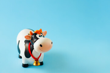 Toy bull on the blue background. Symbol of the Chinese New year 2021. New year's mood. 