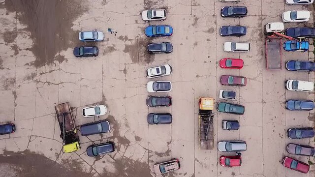 Camera movement downward view of the parking lot of cars evacuated for violations, accelerated filming. Ukraine, Kiev October 15, 2020