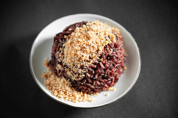 Black rice or organic rice berry with roasted coconut crust or Prik Gub Klur - authentic Thai local cuisine