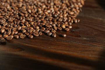 roasted coffee beans on dark wooden background