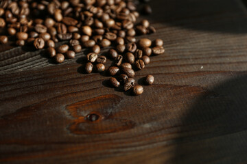 roasted coffee beans on dark wooden background