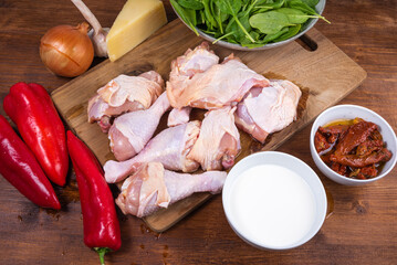 Ingredients for cooking chicken in Tuscan with dried tomatoes and cream