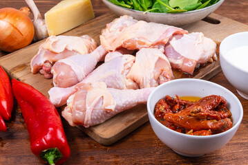Ingredients for cooking chicken in Tuscan with dried tomatoes and cream