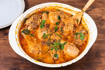 Ready Italian dish - Tuscan chicken with sun-dried tomatoes, tomato paste, spinach, cream and cheese in a frying pan.