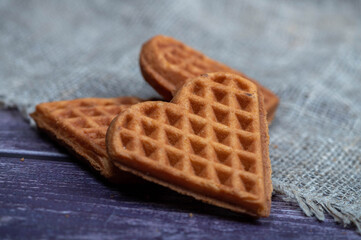 Delicious homemade cookies on the background of rough homespun fabric. Close-up, selective focus.