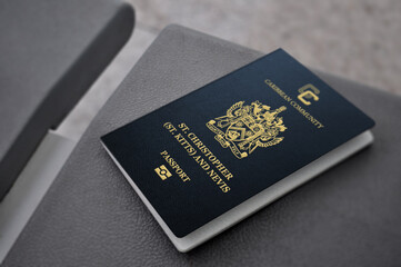 saint kitts and Nevis passport On a leather seat