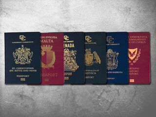 Saint Kitts and Nevis, Malta, Grenada, Dominica, Antigua and Barbuda, Cyprus passport on Cement...