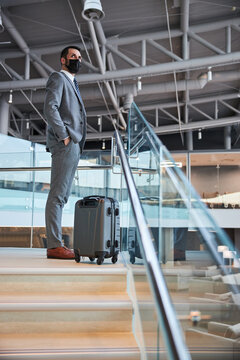 Man Looking Around The Waiting Room From Above