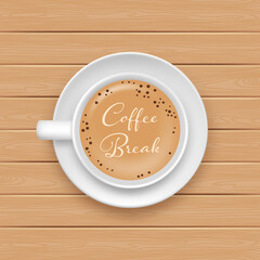 White coffee cup and saucer top view on wood background