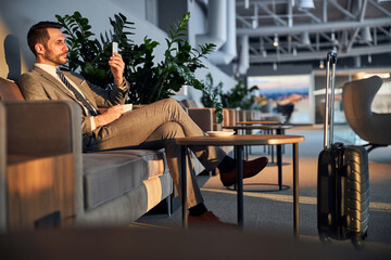 Occupied male with a phone in front of his face