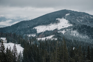 Snowy mountains and amazing sky with clouds in the winter mountains. Background.