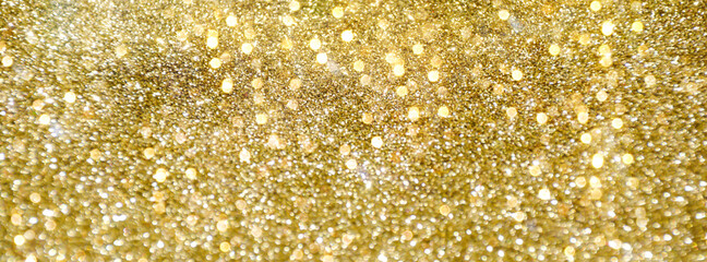 Festive gold glitter background with bokeh lights