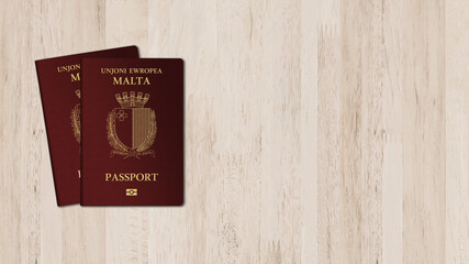 Two Malta passports in white wood background, space for texts