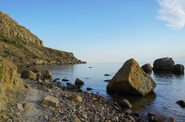 Naklejka premium Mountain sea bay panorama. Beautiful Crimean nature landscape. Beautiful seashore with different stones.