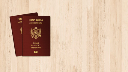 Montenegro passport on wood table, space for texts