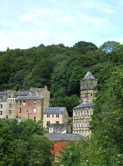 Fototapeta na wymiar view of the streets and houses in hebden bridge in west yorkshire in summer surrounded by trees