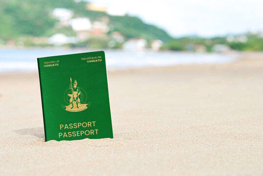 vanuatu passport on the beach sand ,Space for writing