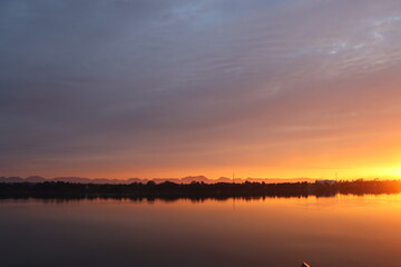 Fototapeta na wymiar Long morning sunrise along the Mekong River bank