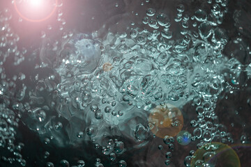 air bubbles on water surface, close view 