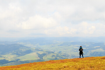 Photographers take pictures of spring view from the top of the mountain Gemba in the Carpathians