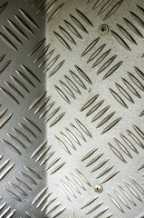 Vertical shot of metal diamond plate texture