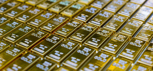 Close-up view of stack shiny gold bar arrangement in a row, Concept of success in business and finance