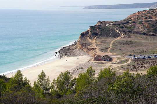 panoramic view of Praia Boca do Rio at south coast of the Algarve near Budens and Burgau with popular parking for Campers / wild camping