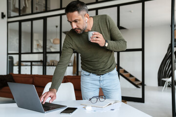 Handsome confident young businessman working