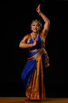 Kuchipudi dancer depicting a Peacock through her performance	