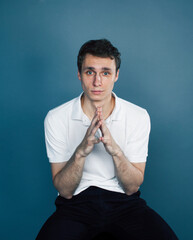 young goofy man with pimples pointing gesturing in studio, stupid bookwarm little crazy, lifestyle people concept