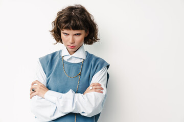 Displeased beautiful girl posing with arms crossed
